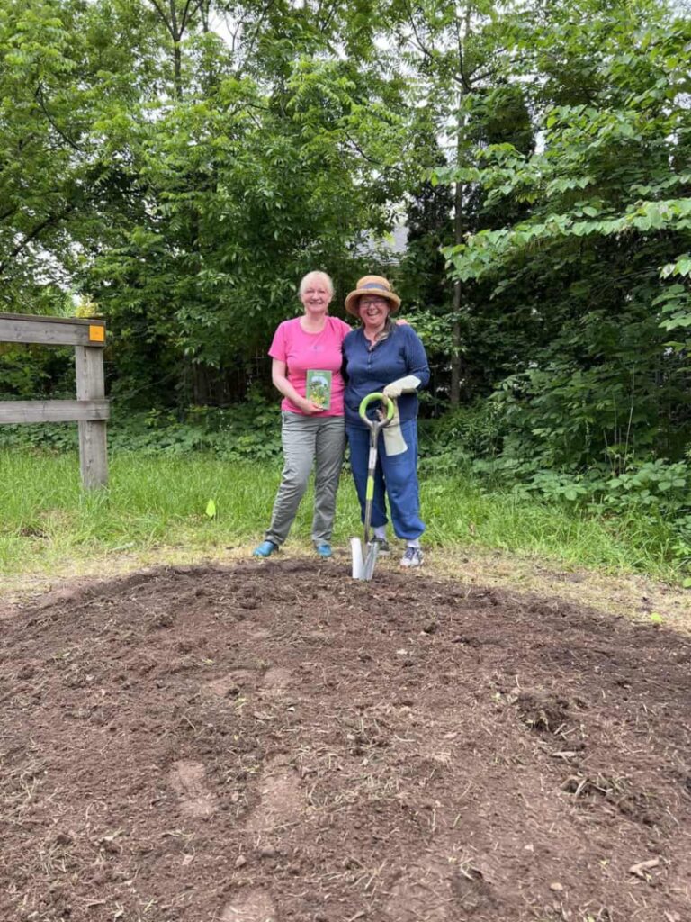 Klara Young-Chin from Friends of One Mile and Janet Trogden organizers of the new pollinator garden at the entrance of the Heritage Trail (Paffard and Charlotte st)